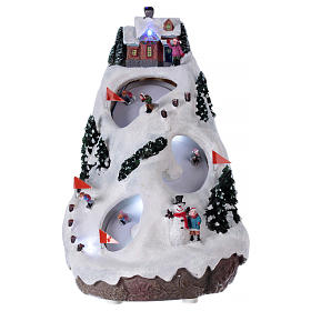 Pueblos navideños en miniatura: Aldea navideña iluminada musical movimiento esquiadores