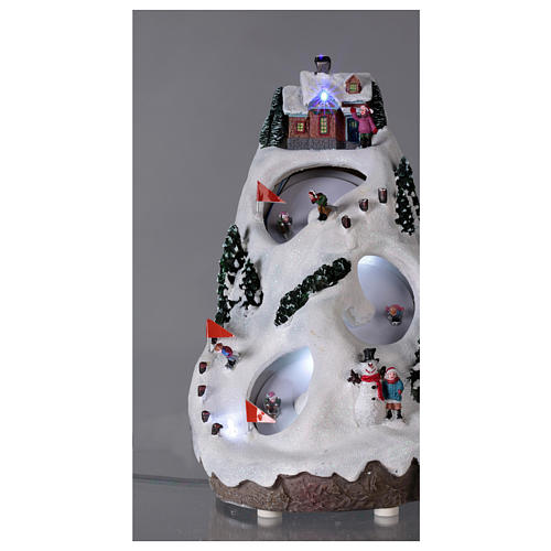 Christmas village illuminated with music movement and skiers 28X19X23 cm 2