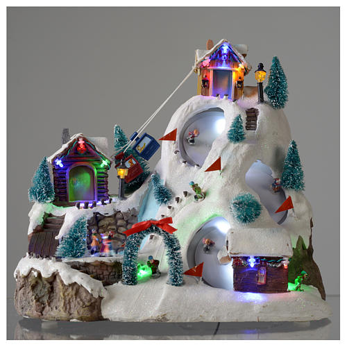 Christmas village illuminated with music, movement, ice rink and small lake 29X31X22 cm 2