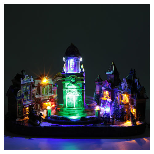 Cenário natalino em miniatura iluminado com música e movimento, torre do relógio 4