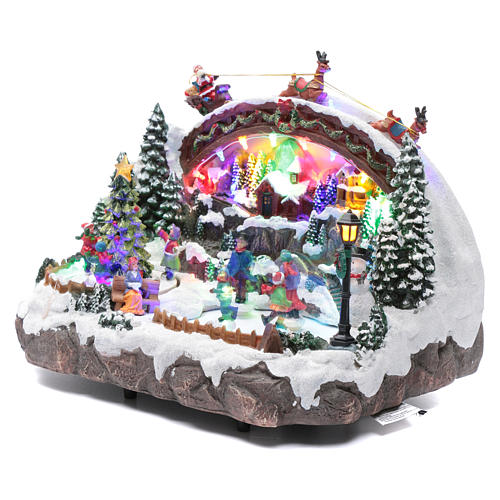 Villaggio natalizio luminoso musicale movimento pattinatori albero natale 24X33X21 cm 2