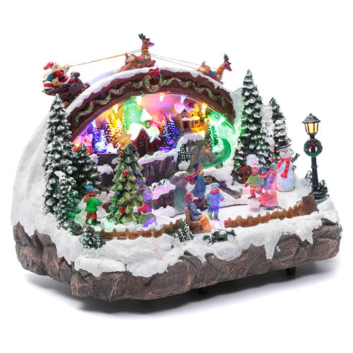 Villaggio natalizio luminoso musicale movimento pattinatori albero natale 24X33X21 cm 3