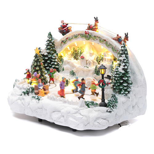 Bożonarodzeniowe miasteczko białe podświetlane muzyczne ruchomi łyżwiarze choinka 24x33x21 cm 2