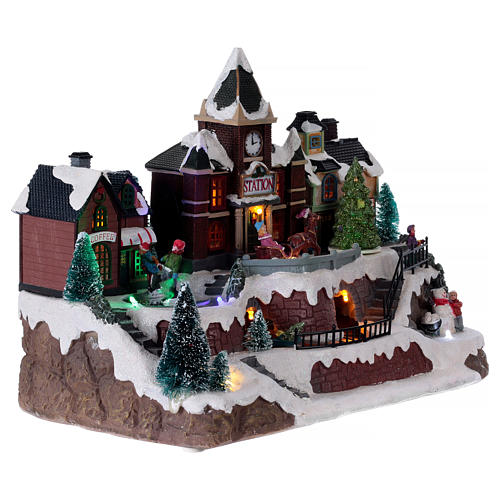 Animated musical Christmas village with train and iced lake 28x34x19 cm 4