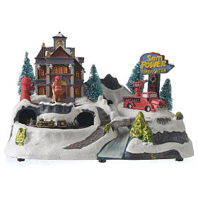 Christmas village with firemen and moving train 23X27X17 cm