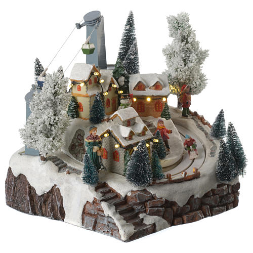 Christmas village with skiers and cable car with illumination and music 30x25x25 cm 3