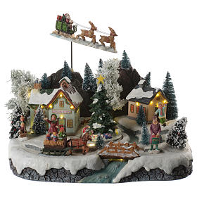 Pueblos navideños en miniatura: Aldea navideña papá noel volando en movimiento iluminado con música 30x25x25