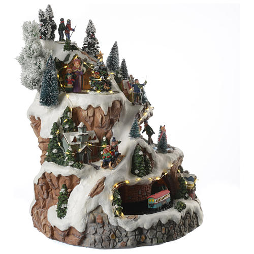 Christmas village with mountains equipped with illumination and movement 30x30x40 cm 3