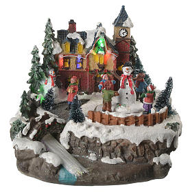 Illuminated Christmas village with children and movement 20x20x20