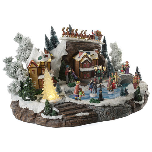 Christmas village with lake, skaters and moving sledge with music, lights and movement 55x40x30 cm 3