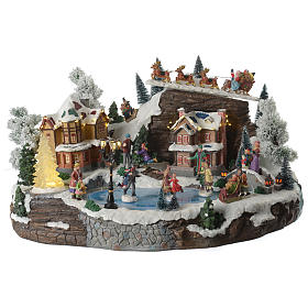 Christmas village with animated Santa Claus, skaters and lake sounds and lights 55x40x30 cm