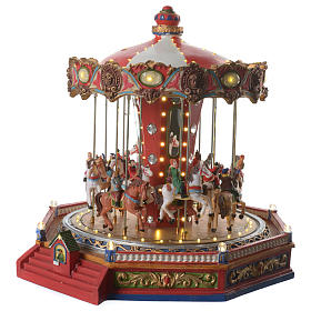 Moving merry go round with horses Christmas scene with lights and music 35x35x35 cm