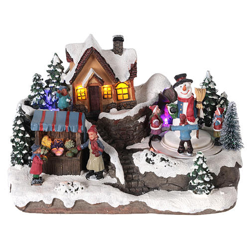 Village de Noël enfant et bonhomme de neige en mouvement éclairé 24x15x15 cm 1