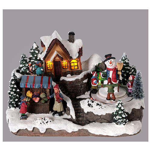 Village de Noël enfant et bonhomme de neige en mouvement éclairé 24x15x15 cm 2