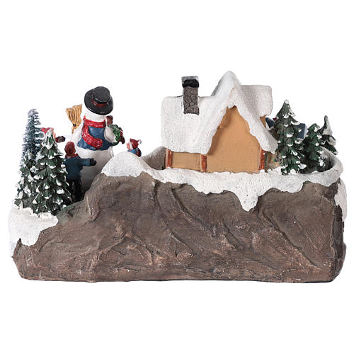 Village de Noël enfant et bonhomme de neige en mouvement éclairé 24x15x15 cm 5