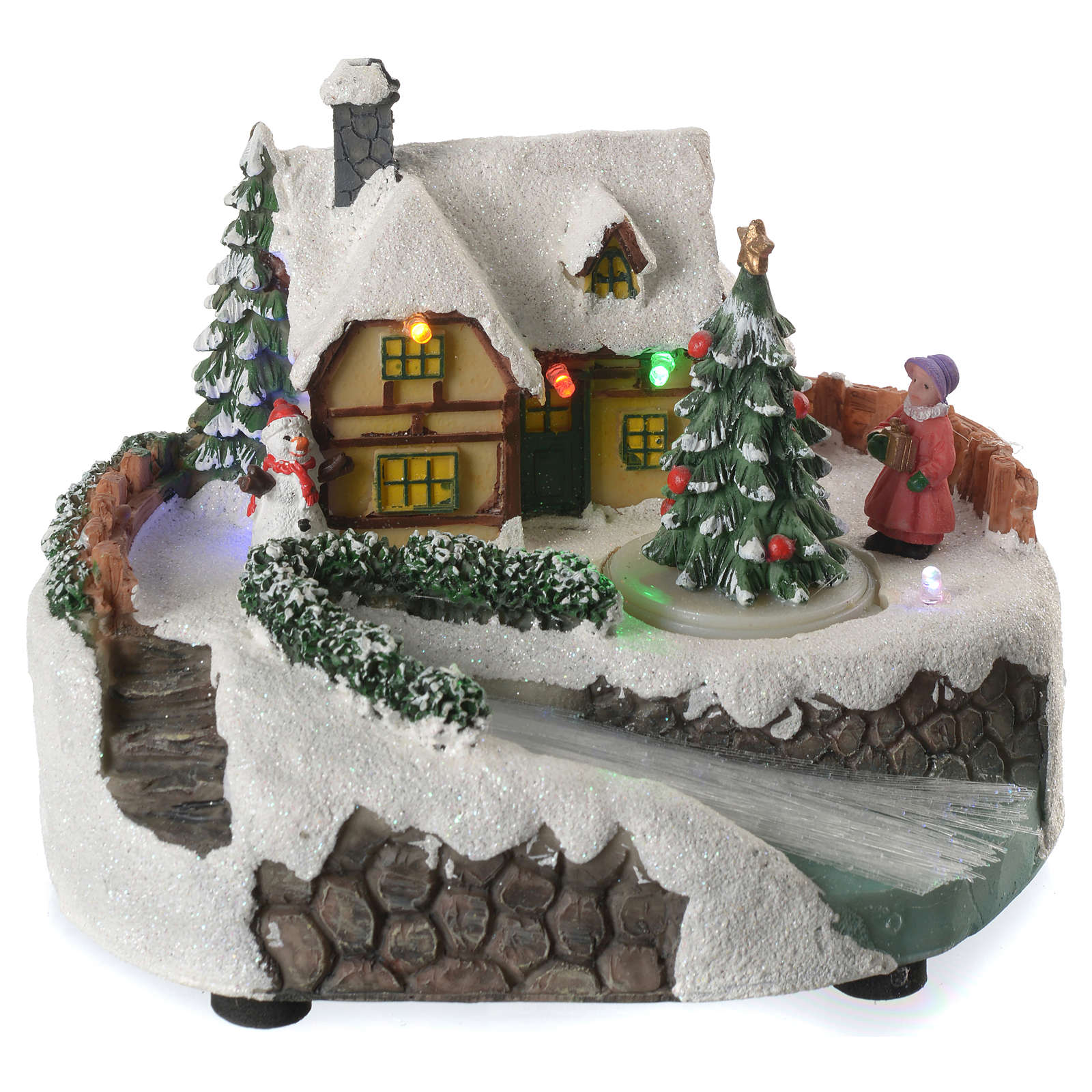 Illuminated Christmas village with snowman and turning tree | online ...