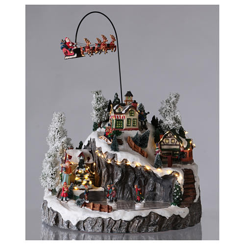 Illuminated Christmas village, animated sleigh pulled by reindeers 35x40x35 2