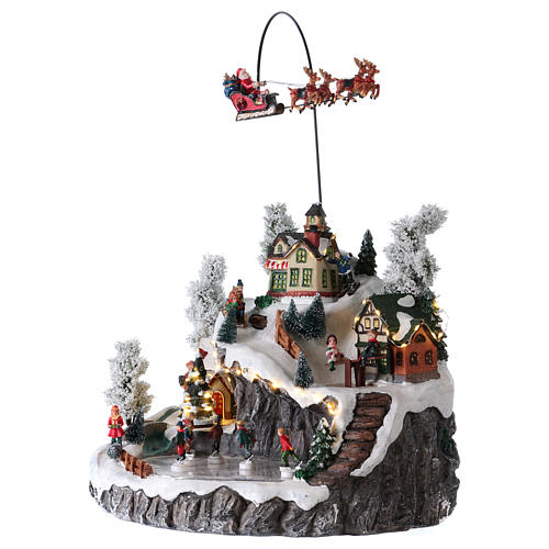 Illuminated Christmas village, animated sleigh pulled by reindeers 35x40x35 3