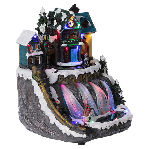 Animated musical Christmas village with train and frozen lake 30x25x30 cm 4