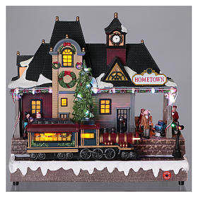 Winterszenen: Weihnachtsdorf beleuchteter Bahnhof mit Zug in Bewegung 30x30x15 mit Batterie und Netzanschluss Winterszenen: Weihnachtsdorf beleuchteter Bahnhof mit Zug in Bewegung 30x30x15 mit Batterie und Netzanschluss