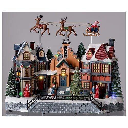 Christmas village with lights and Santa Claus movement 30x35x20 cm 2