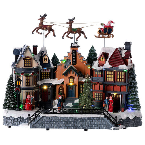Cenário natalino aldeia com Pai Natal e renas movimento, luzes e música, corrente 220 V, 32x37x20 cm 1