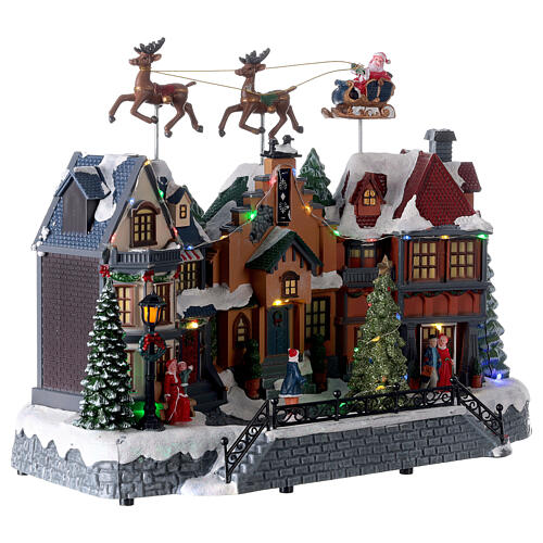 Cenário natalino aldeia com Pai Natal e renas movimento, luzes e música, corrente 220 V, 32x37x20 cm 4