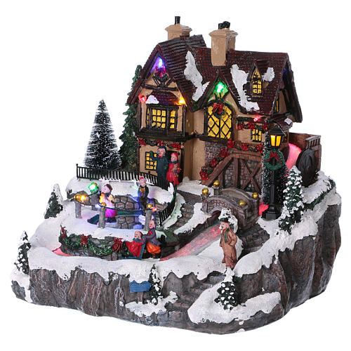 Christmas village with lights and moving ice skaters 25x25x25 cm 3