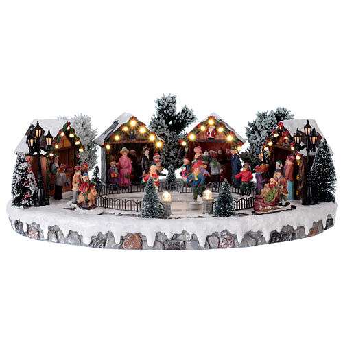 Scenka świąteczny jarmark 6 łyżwiarzy ruchomych światła muzyka 20x45x35 zasilacz 1