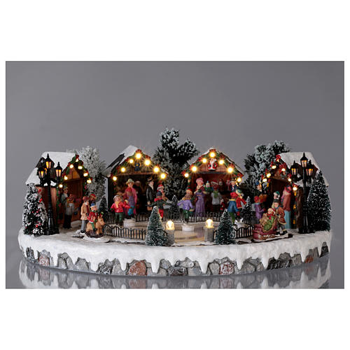 Christmas village with animated ice skaters and music 20x45x35 cm 2