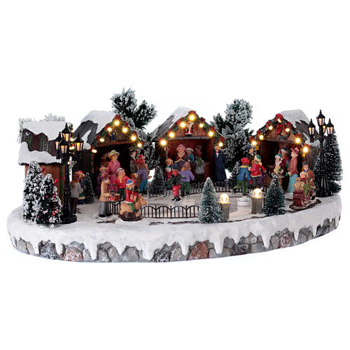 Christmas village with animated ice skaters and music 20x45x35 cm 4