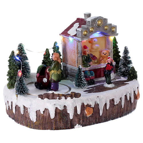 Christmas village with lights, music and moving woman with baby carriage 15x20x10 cm 4