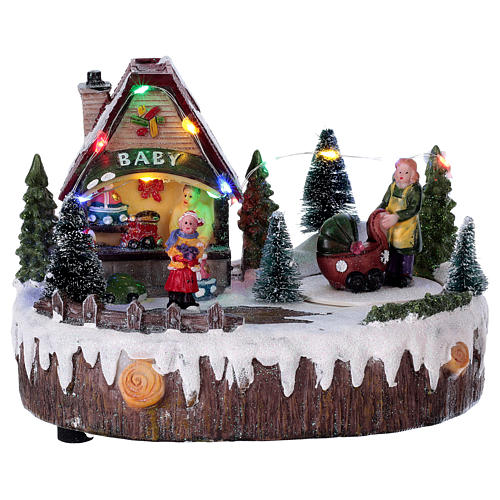 Christmas village with lights, music, shop and moving woman with baby carriage 15x20x10 cm 1