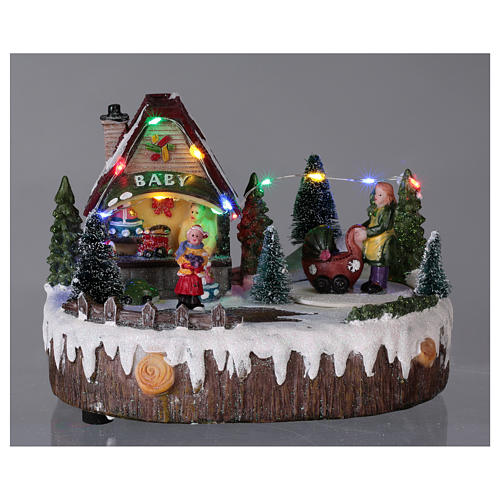 Christmas village with lights, music, shop and moving woman with baby carriage 15x20x10 cm 2