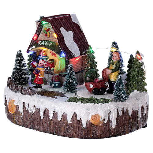 Christmas village with lights, music, shop and moving woman with baby carriage 15x20x10 cm 3