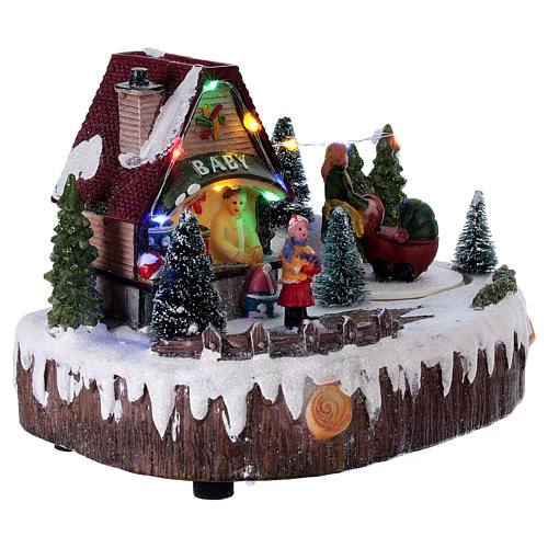 Christmas village with lights, music, shop and moving woman with baby carriage 15x20x10 cm 4