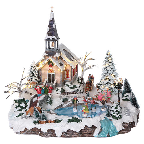 Christmas village with lights and moving ice skaters 45x50x45 cm 1