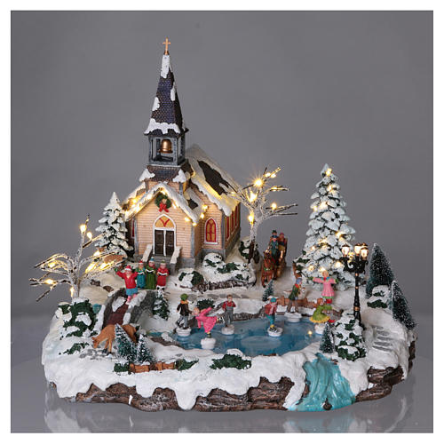 Illuminated Christmas village with animated ice skaters and Church 45x49x46 cm 2