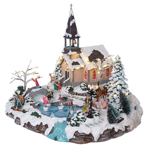 Illuminated Christmas village with animated ice skaters and Church 45x49x46 cm 3