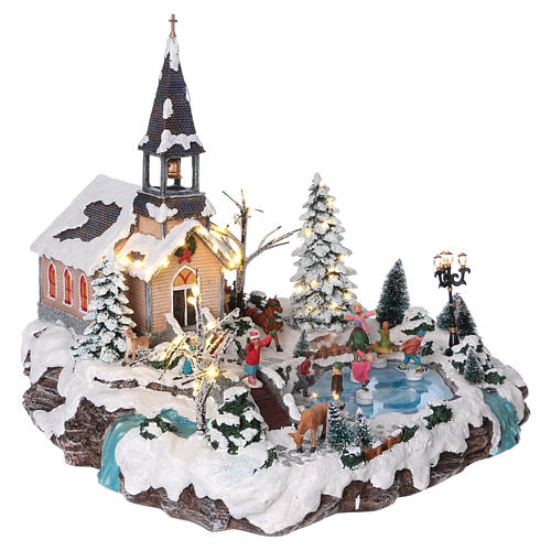 Illuminated Christmas village with animated ice skaters and Church 45x49x46 cm 4