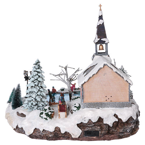 Illuminated Christmas village with animated ice skaters and Church 45x49x46 cm 5