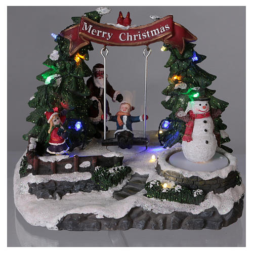 Christmas village with moving snowman and swing 20x20x20 cm 2