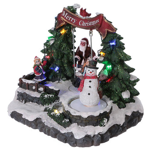 Christmas village with moving snowman and swing 20x20x20 cm 3