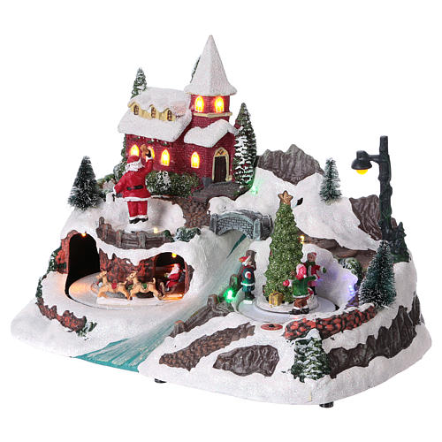 Christmas village with moving ice-skaters and Santa Claus 20x30x20 cm 3