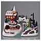Christmas village with moving ice-skaters and Santa Claus 20x30x20 cm s2