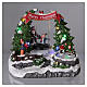 Christmas village with LED lights, moving ice-skaters and swing 20x25x20 cm s2