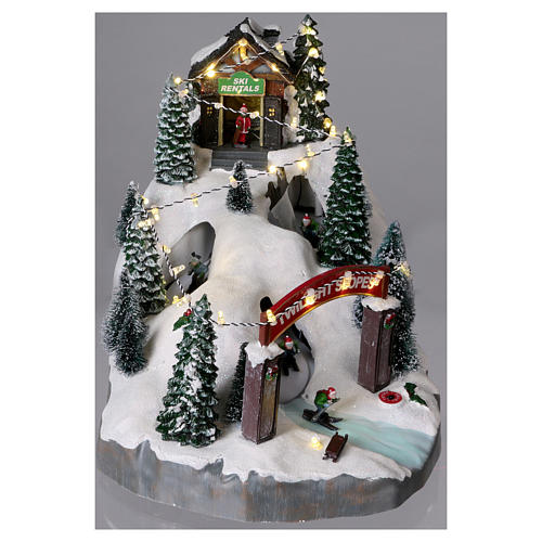 Christmas Town with Moving Skiers25x25x35 cm Battery and Power Operated 2