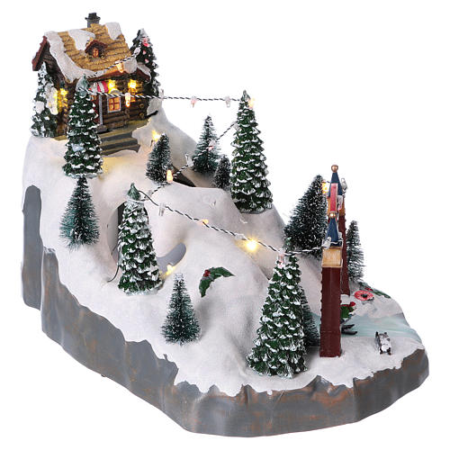 Christmas village 25x25x35 cm with moving skiers requiring batteries or electricity 4