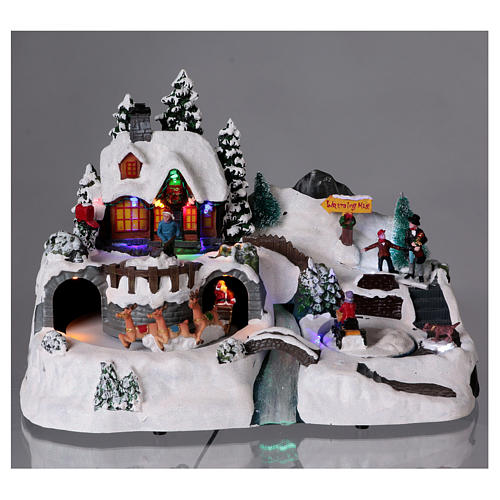 Christmas village with moving characters and Santa Claus 25x35x25 cm 2