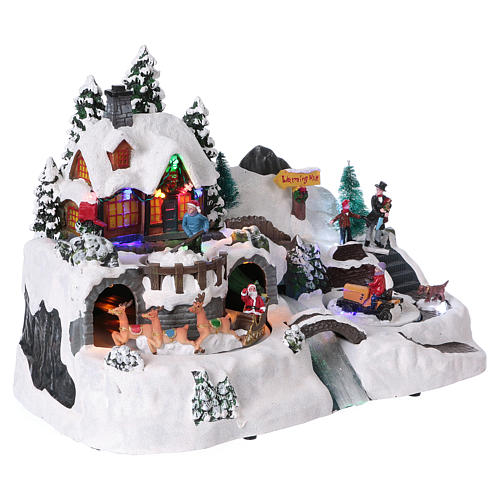 Christmas village with moving characters and Santa Claus 25x35x25 cm 4